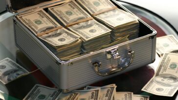 hard cash on a briefcase