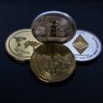 four assorted cryptocurrency coins